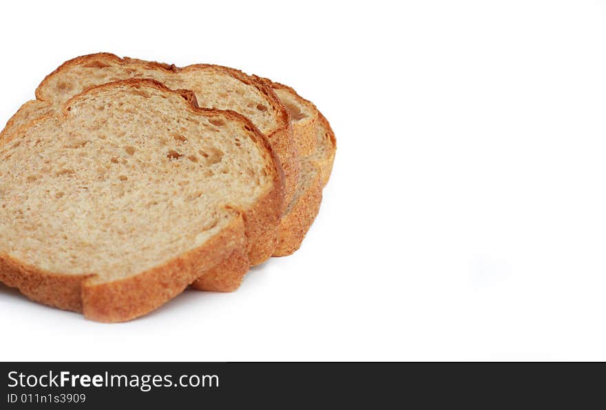 Three slices of wheat bread isolated on white background. Three slices of wheat bread isolated on white background.