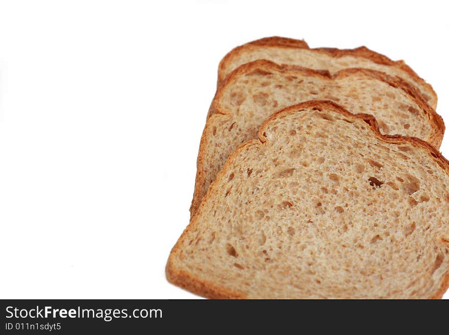 Three slices of wheat bread isolated on white background. Three slices of wheat bread isolated on white background.