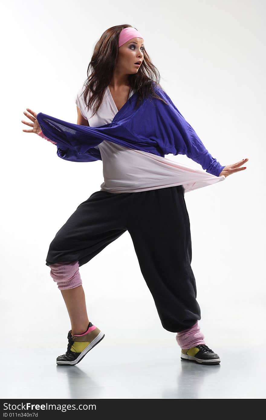 Cool looking dancer posing on a white background. Cool looking dancer posing on a white background