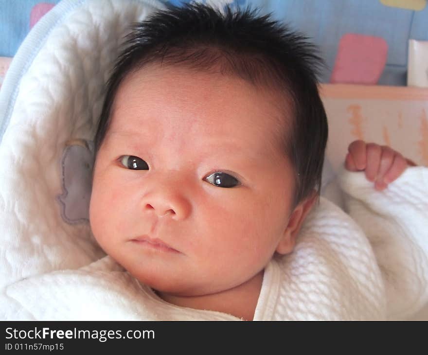 Lovely infant on a bed