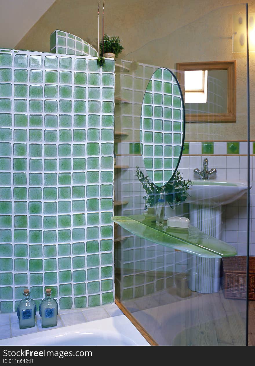 Big bathroom with green mosaic