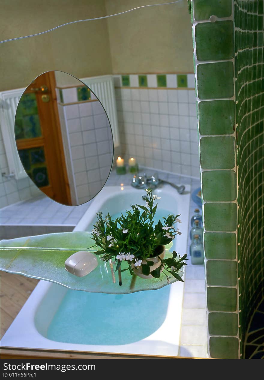 Big bathroom with green mosaic