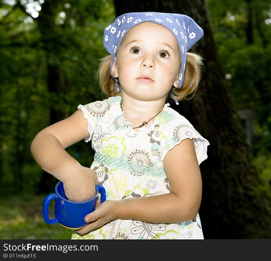 Portrait of little girl playing outdoor