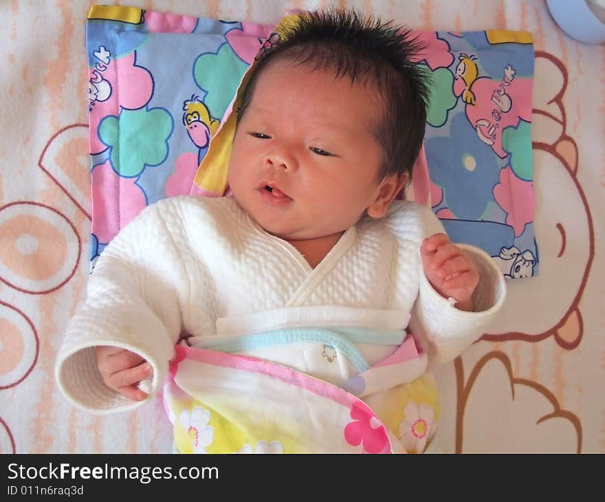 Lovely baby on a bed