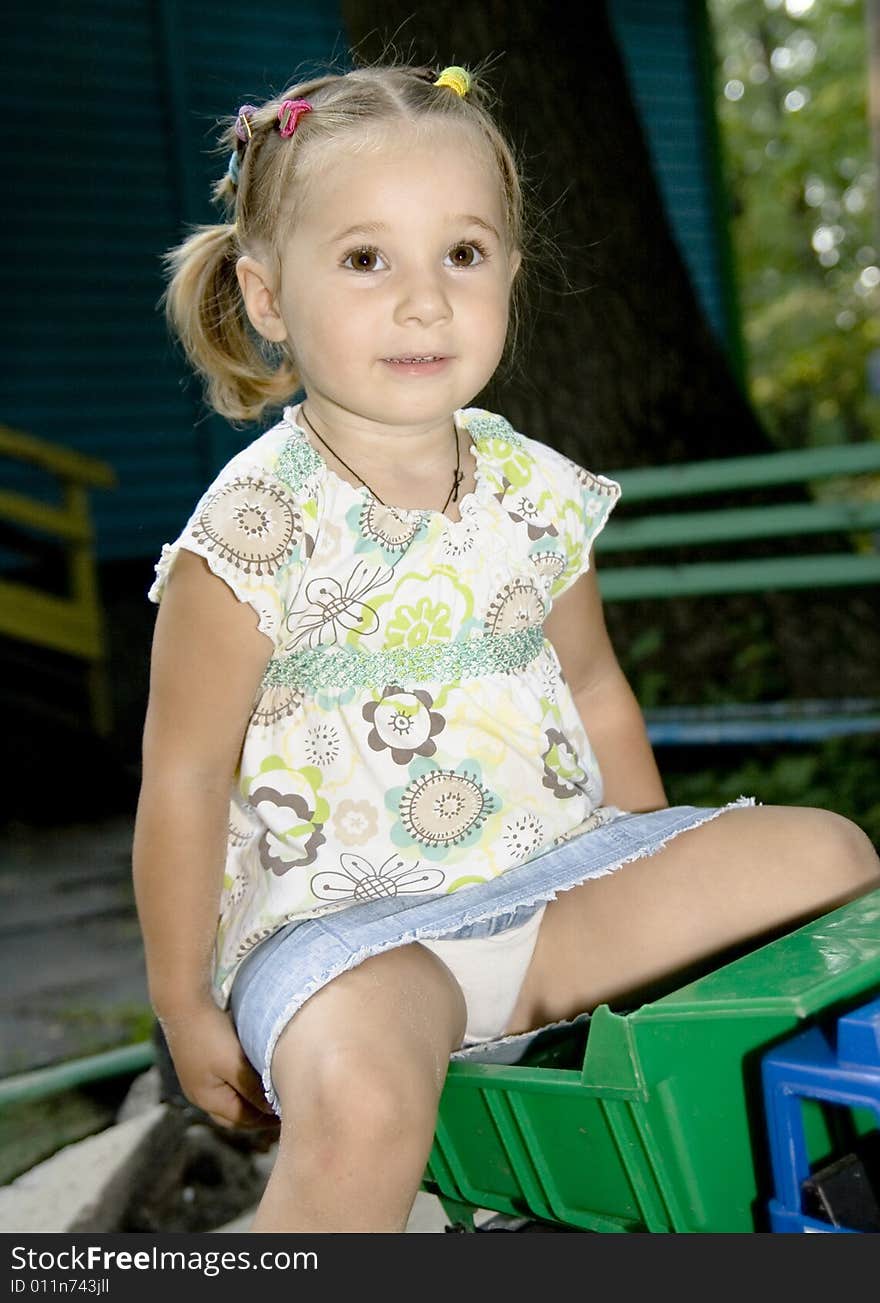 Little girl playing with truck