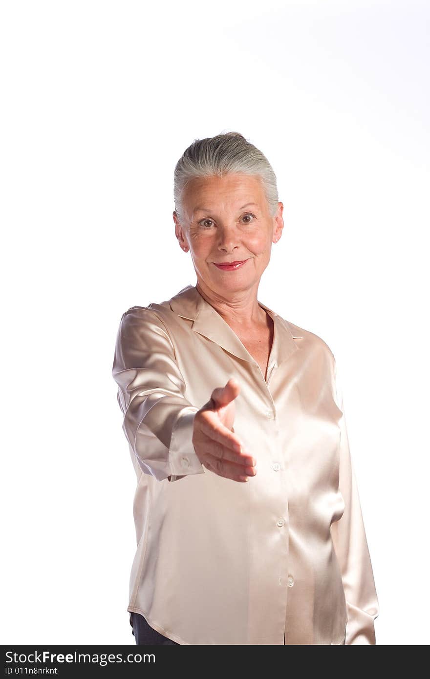 Portrait of senior female executive against white background