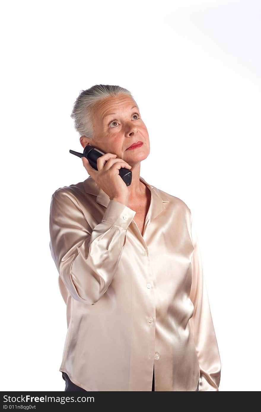 Portrait of senior female executive against white background