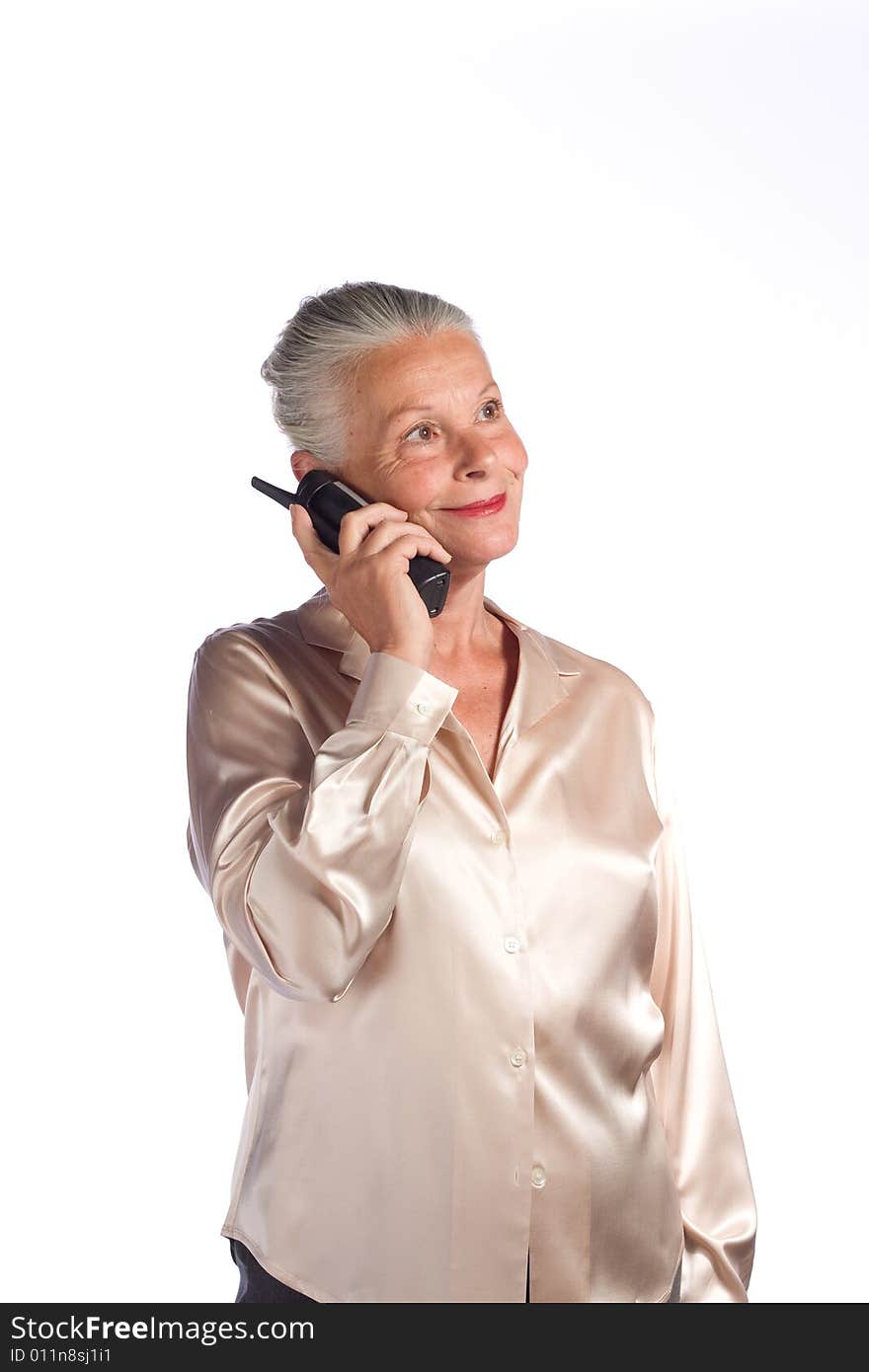 Portrait of senior female executive against white background