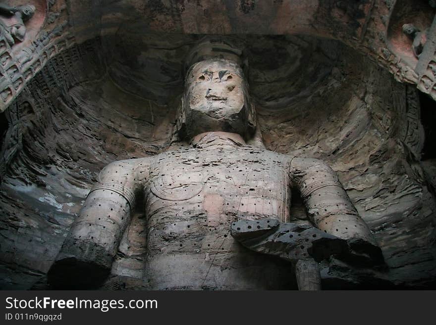 Stone carving in Yungang Grottoes, Datong, Shanxi province of China.

CAVE 17(A.D.460-465)
A crossed-legged Maitreya, 15.6 metres high, is carved on the north wall, a seated buddha on the east wall, and a standing buddha on the west wall, which are generally named The Trikala Buddhas. Stone carving in Yungang Grottoes, Datong, Shanxi province of China.

CAVE 17(A.D.460-465)
A crossed-legged Maitreya, 15.6 metres high, is carved on the north wall, a seated buddha on the east wall, and a standing buddha on the west wall, which are generally named The Trikala Buddhas.