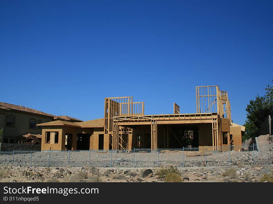 A new home under construction in the desert southwest. A new home under construction in the desert southwest