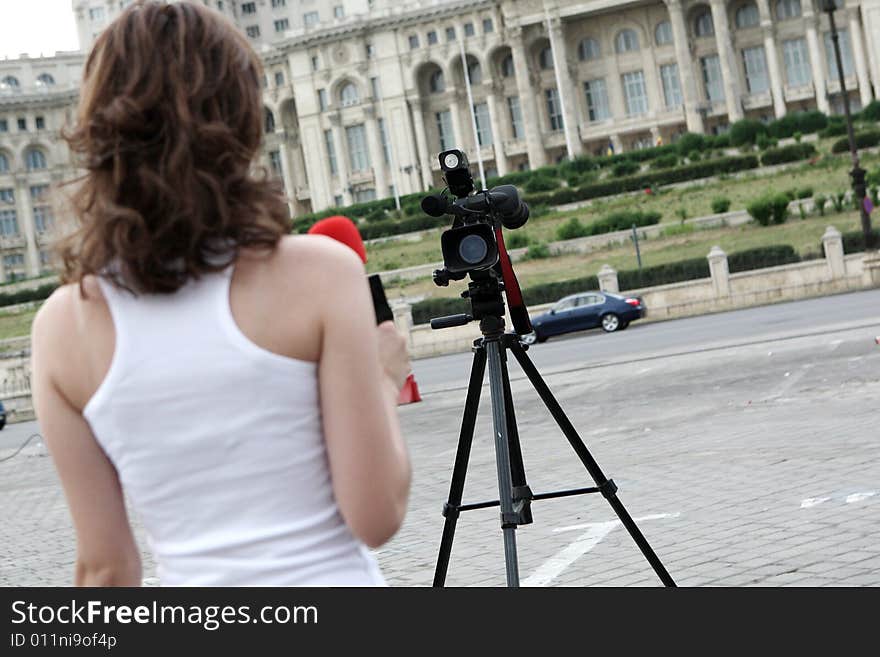 A young and nice reporter girl