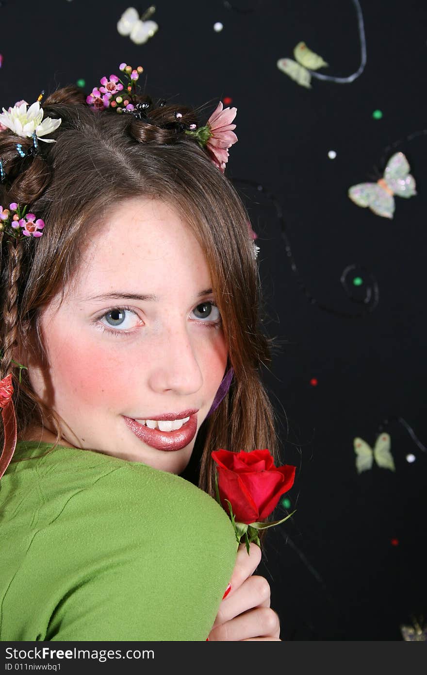 Teenage model with flowers and butterflies in her hair. Teenage model with flowers and butterflies in her hair