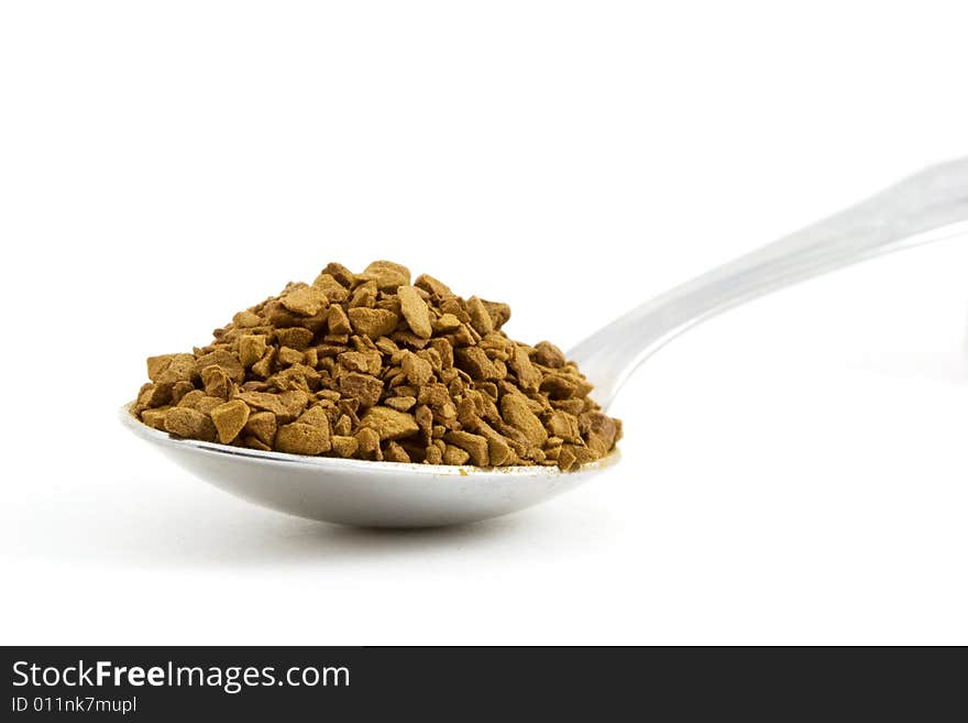 Isolated photo of a spoon felled with coffee. Isolated photo of a spoon felled with coffee