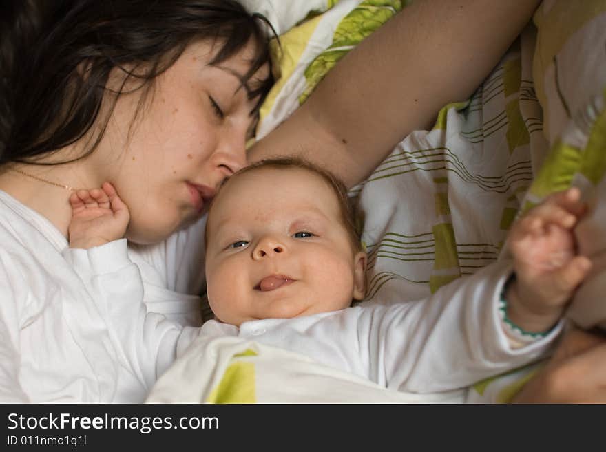 Baby with mom in the bed. Baby with mom in the bed