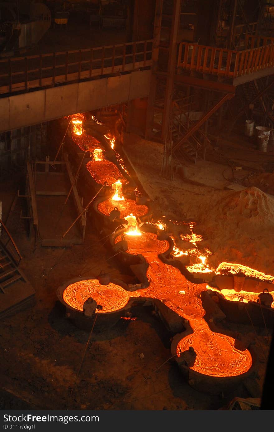 Glowing, molten hot steel. Stell casting. Glowing, molten hot steel. Stell casting.