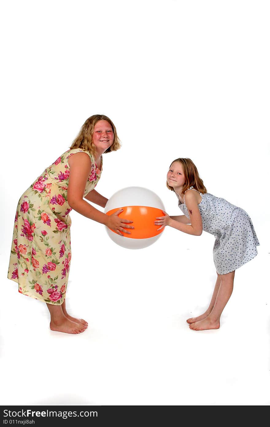 Sisters Holding Beach Ball