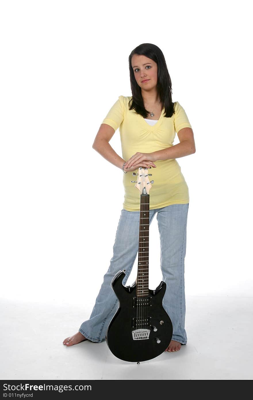 Cute teen standing with electric guitar. Cute teen standing with electric guitar