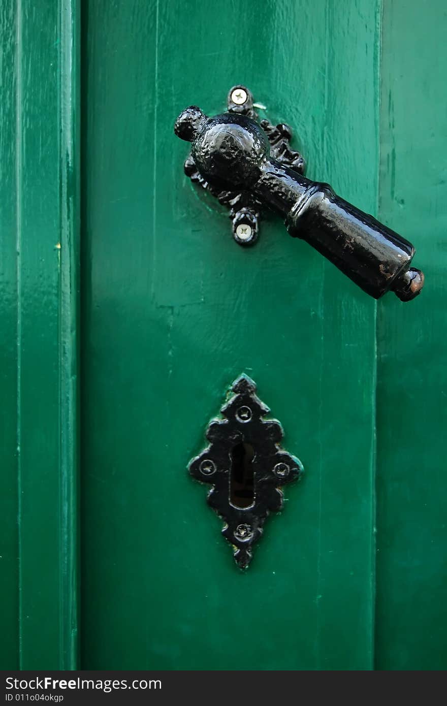 Old door handle, green door