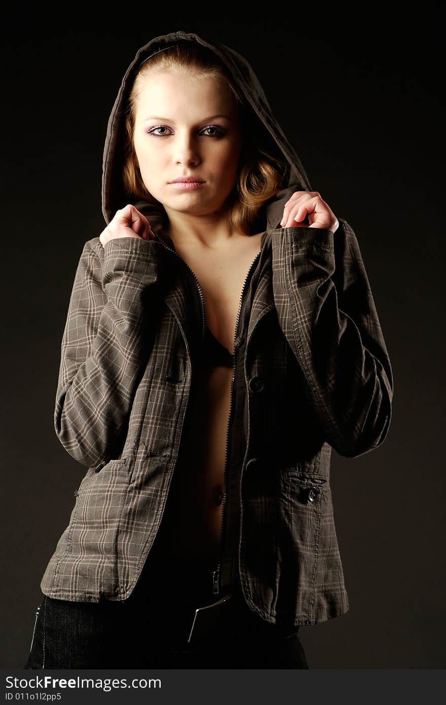 A portrait of young lady on black background. A portrait of young lady on black background