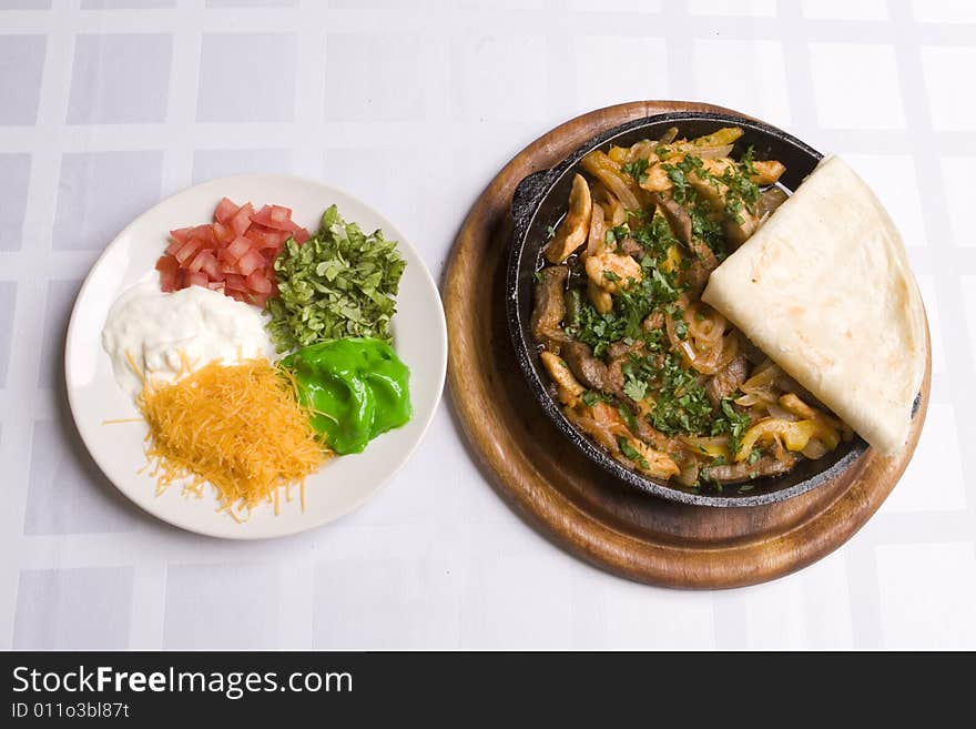 Fajitas on the table with different sauces