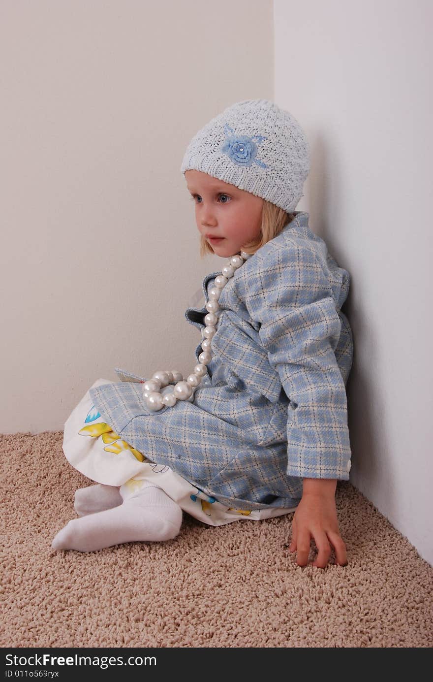 Pretty little girl in nice clothe and beads