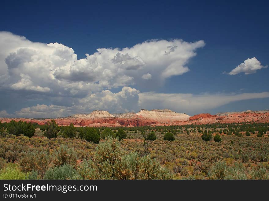 View of the red rock formations in Kodachrome Basin with blue skys and clouds