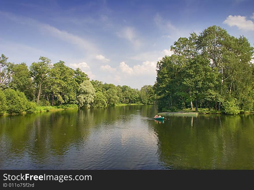 Boat In Summer Pond