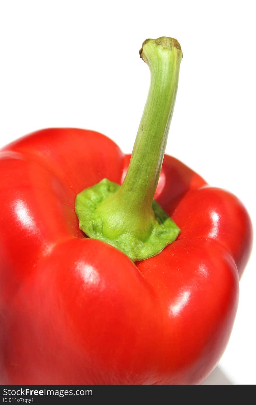 Extreme close-up of red pepper against white background. Extreme close-up of red pepper against white background