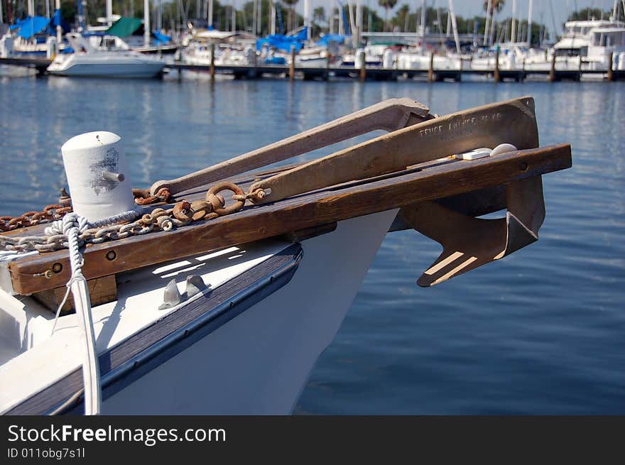 Anchor hanging off the bow of a sailboat