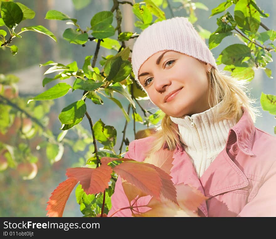 Girl with autumn leaves