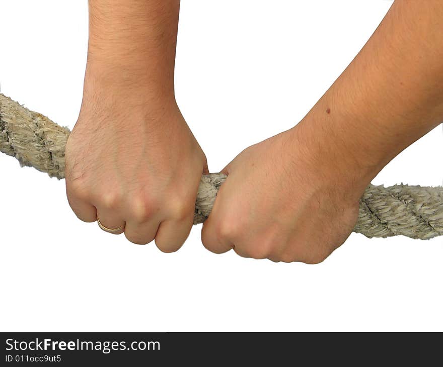 The hands of man hold a rope tensely. The hands of man hold a rope tensely