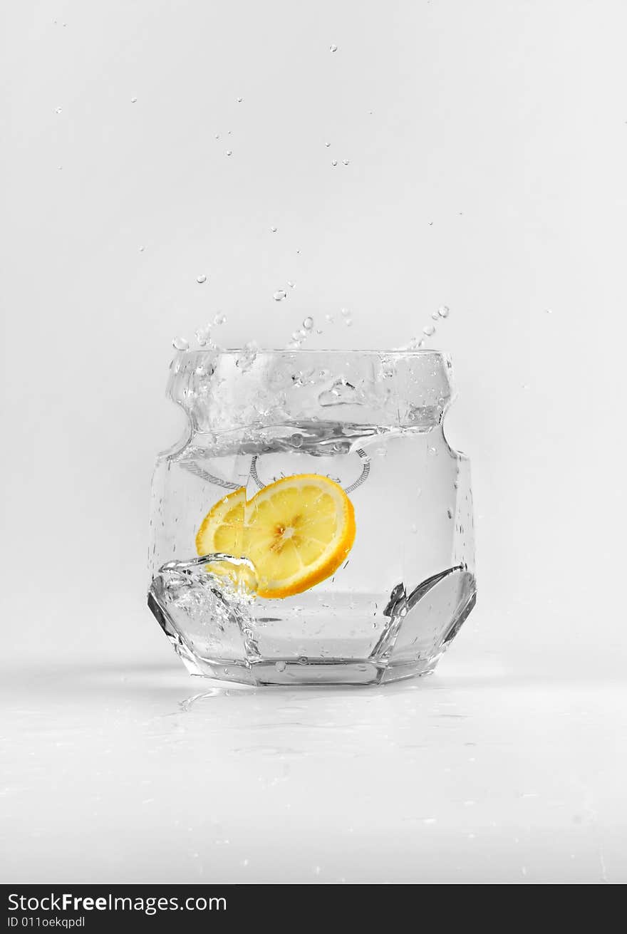 A piece of lemon in the water.