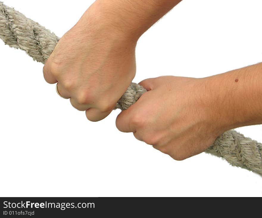 The hands of man hold a rope tensely. The hands of man hold a rope tensely