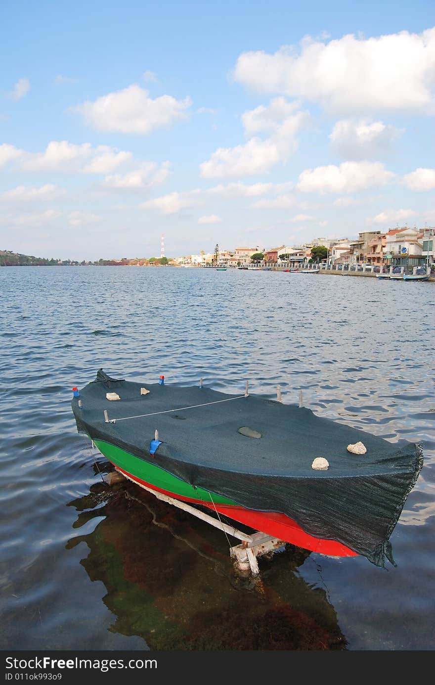 A boat in the lake of Ganzirri in the city of Messina. A boat in the lake of Ganzirri in the city of Messina