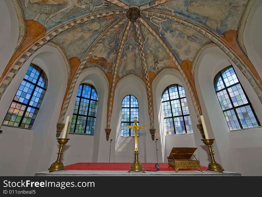 Window vieuw of a medieval church with fresco's on the ceiling. Window vieuw of a medieval church with fresco's on the ceiling