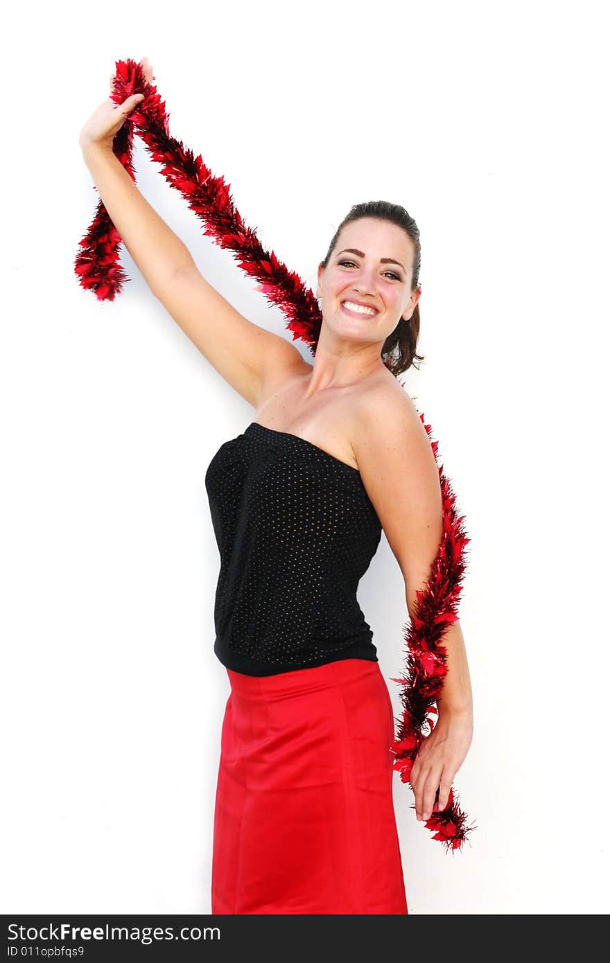 Portrait of a beautiful young brunette woman with tinsel for Christmas - isolated. Portrait of a beautiful young brunette woman with tinsel for Christmas - isolated.