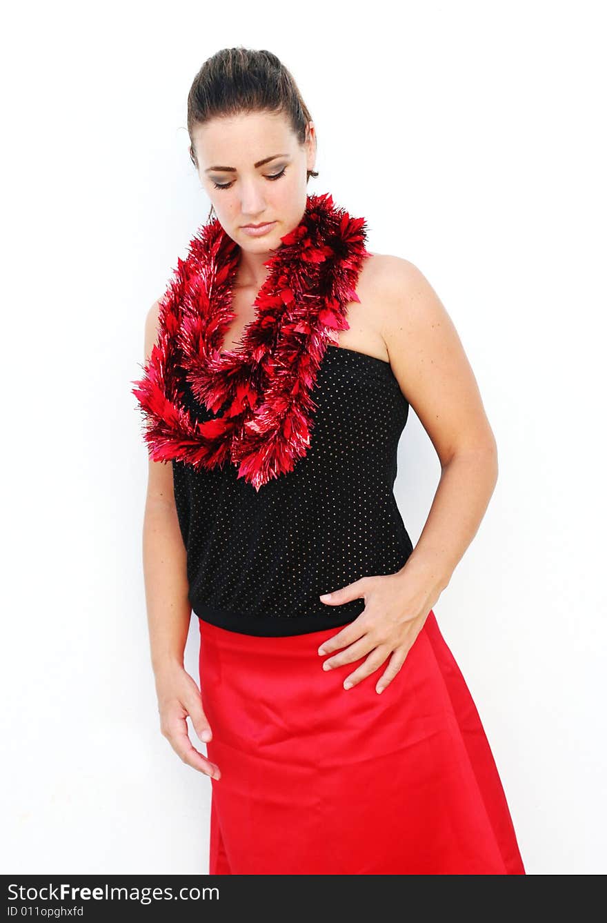 Portrait of a beautiful young brunette woman with tinsel for Christmas - isolated. Portrait of a beautiful young brunette woman with tinsel for Christmas - isolated.