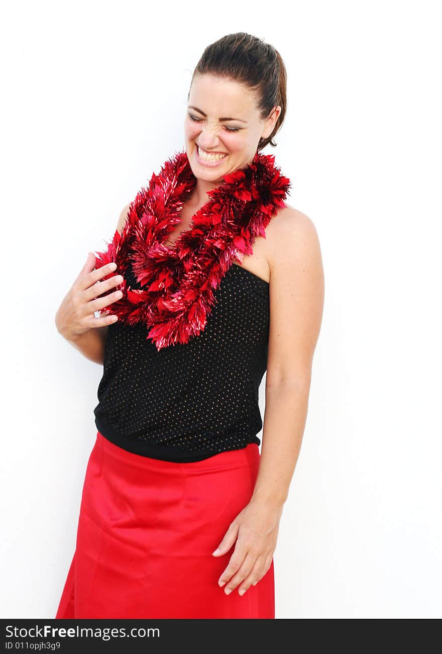 Portrait of a beautiful young brunette woman with tinsel for Christmas - isolated. Portrait of a beautiful young brunette woman with tinsel for Christmas - isolated.