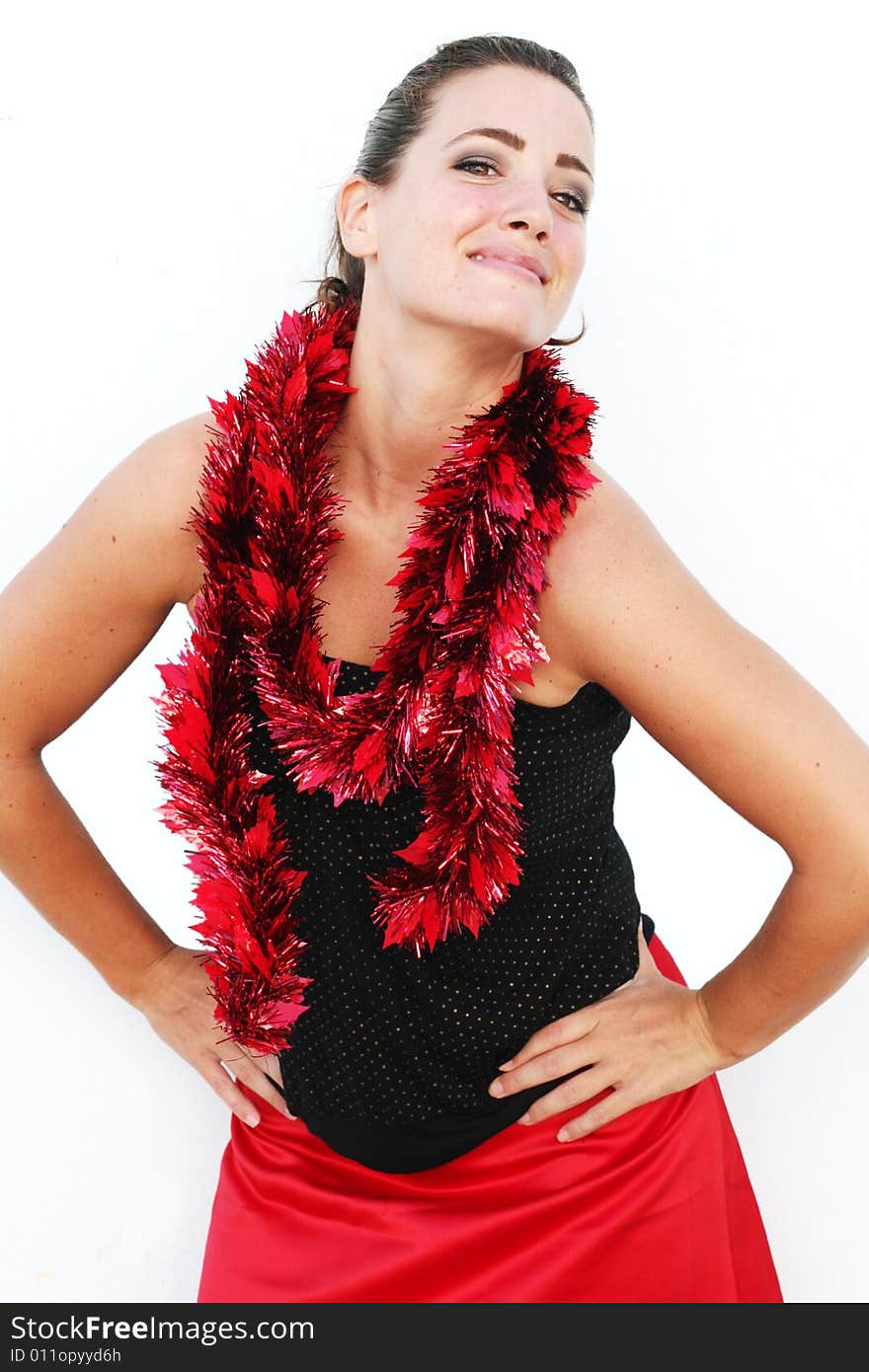 Portrait of a beautiful young brunette woman with tinsel for Christmas - isolated. Portrait of a beautiful young brunette woman with tinsel for Christmas - isolated.