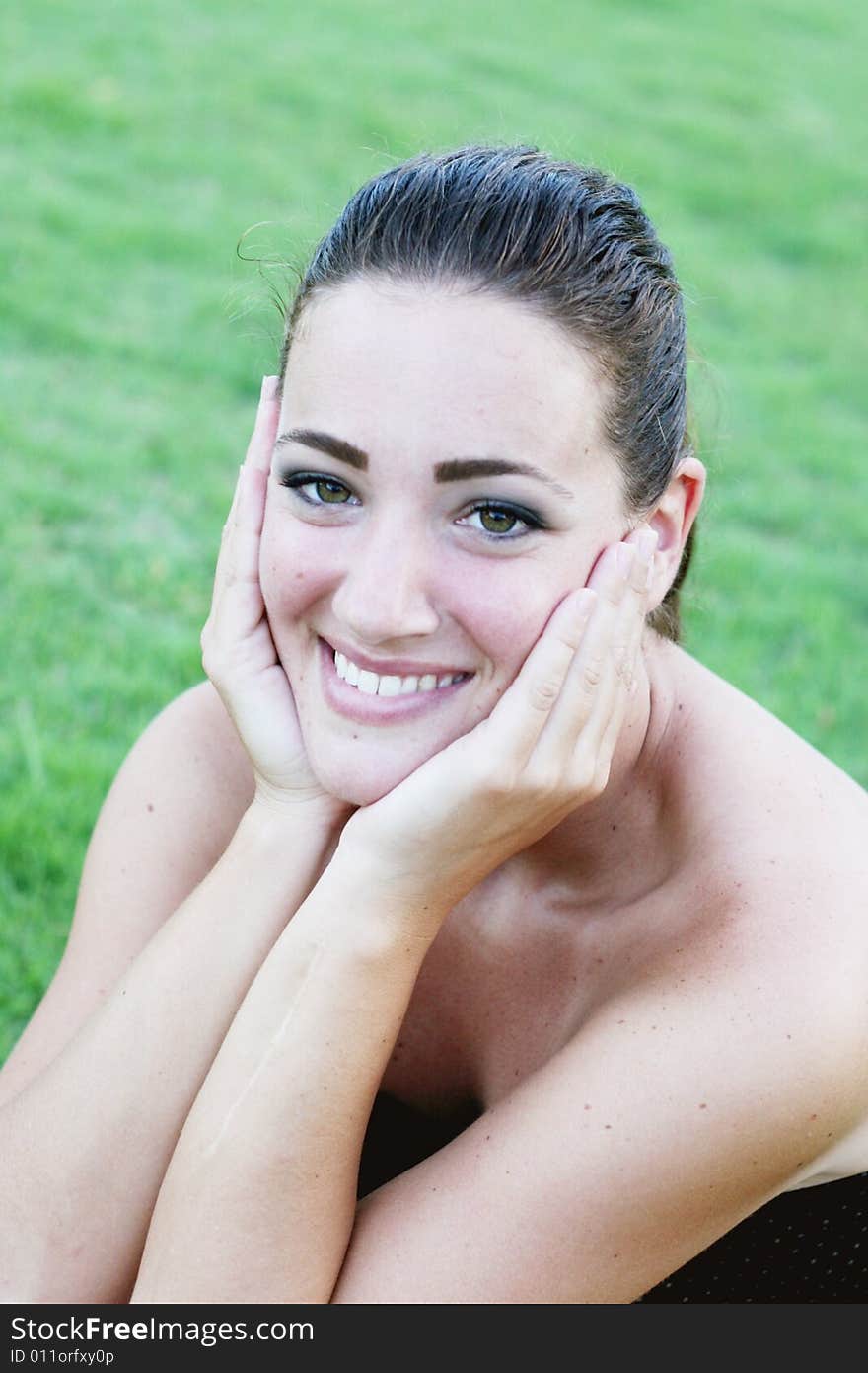 Portrait of a happy young brunette woman.