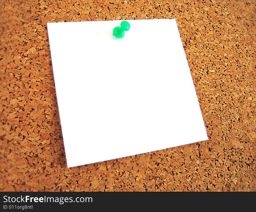 White blank note pined to cork board. White blank note pined to cork board