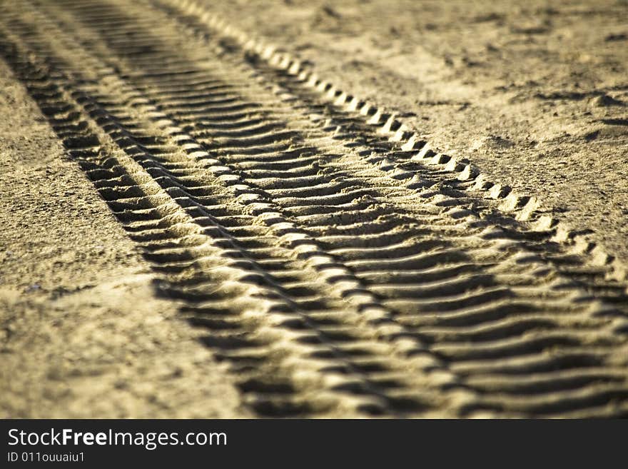 Tire`s tracks printed in the sand. Tire`s tracks printed in the sand