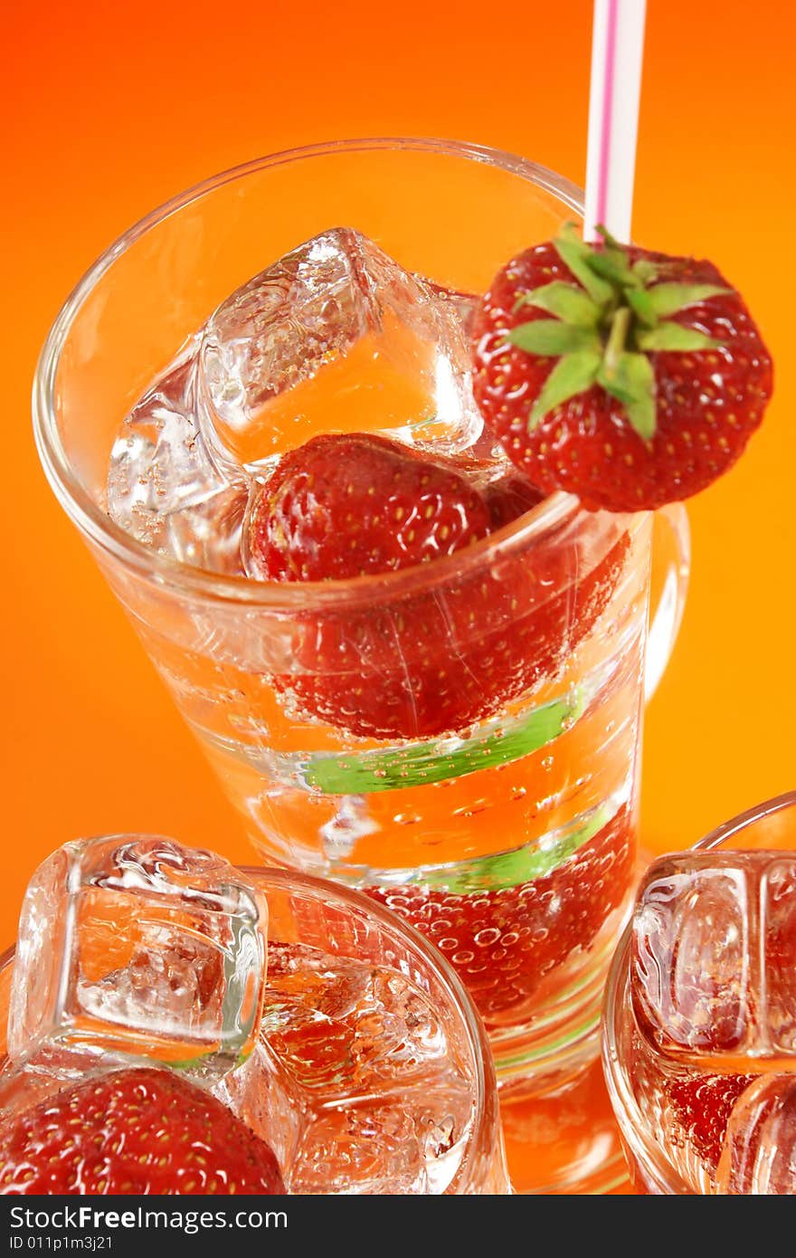 Fresh iced drink (water) served with strawberries. Fresh iced drink (water) served with strawberries