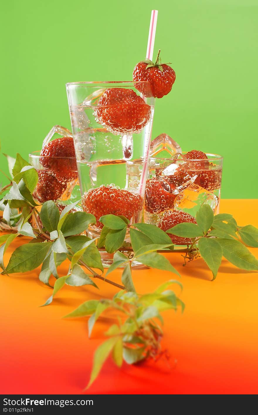 Fresh iced drink (water) served with strawberries. Fresh iced drink (water) served with strawberries