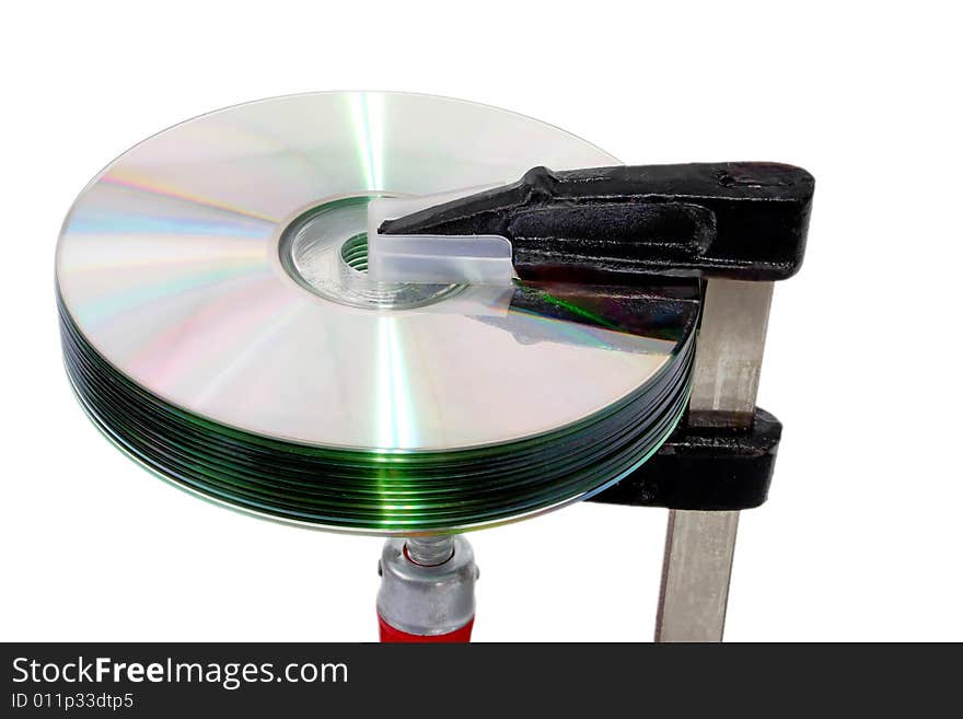 DVD disk in a screw clamp isolated on white background. DVD disk in a screw clamp isolated on white background