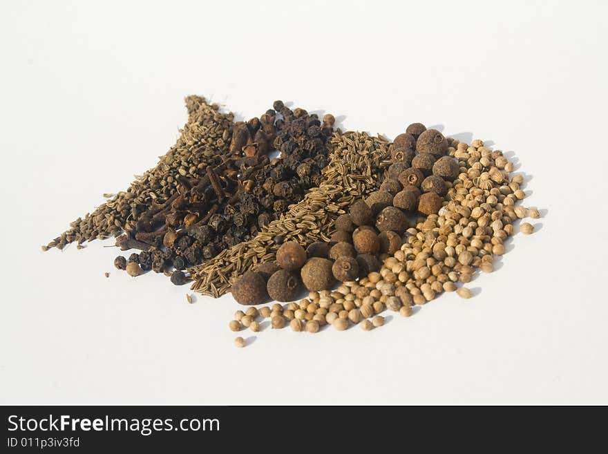 Various spices against white background