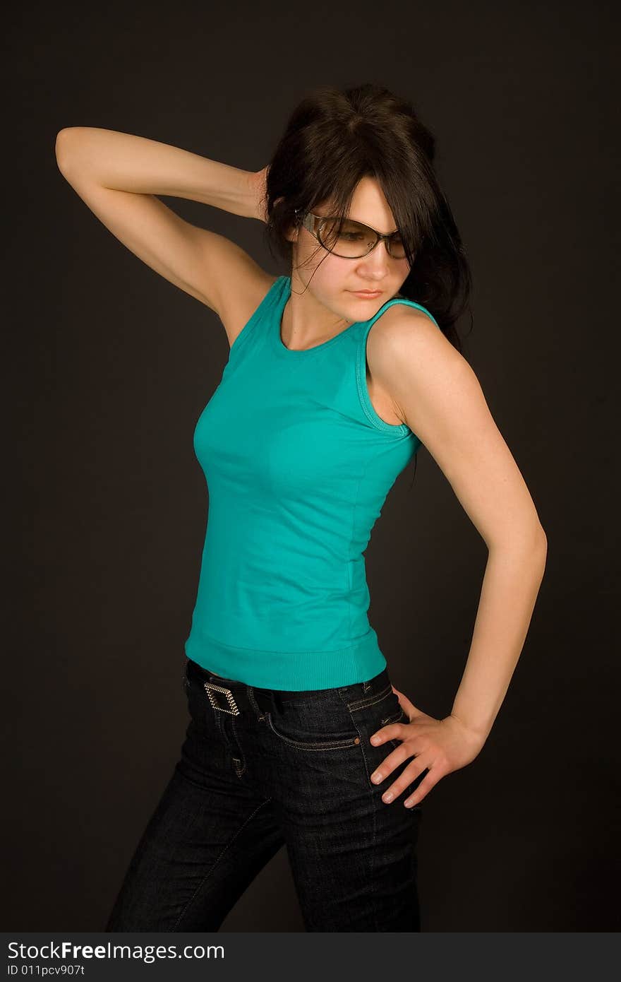 Beautiful girl in casual clothing isolated on black background