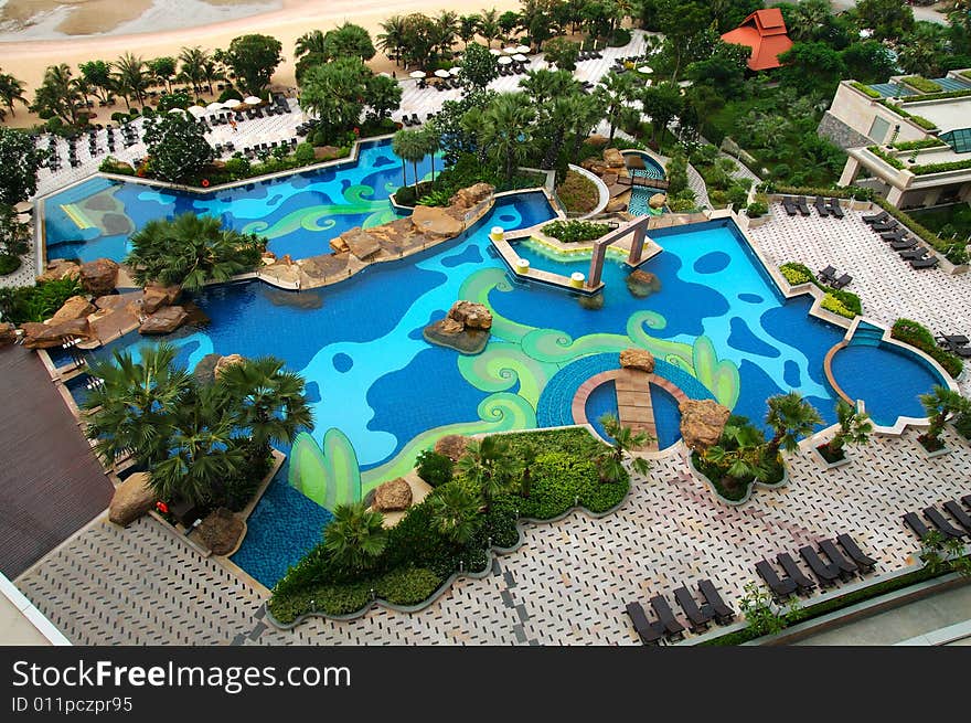 Trestle-beds and umbrellas near the resort's pool. Trestle-beds and umbrellas near the resort's pool