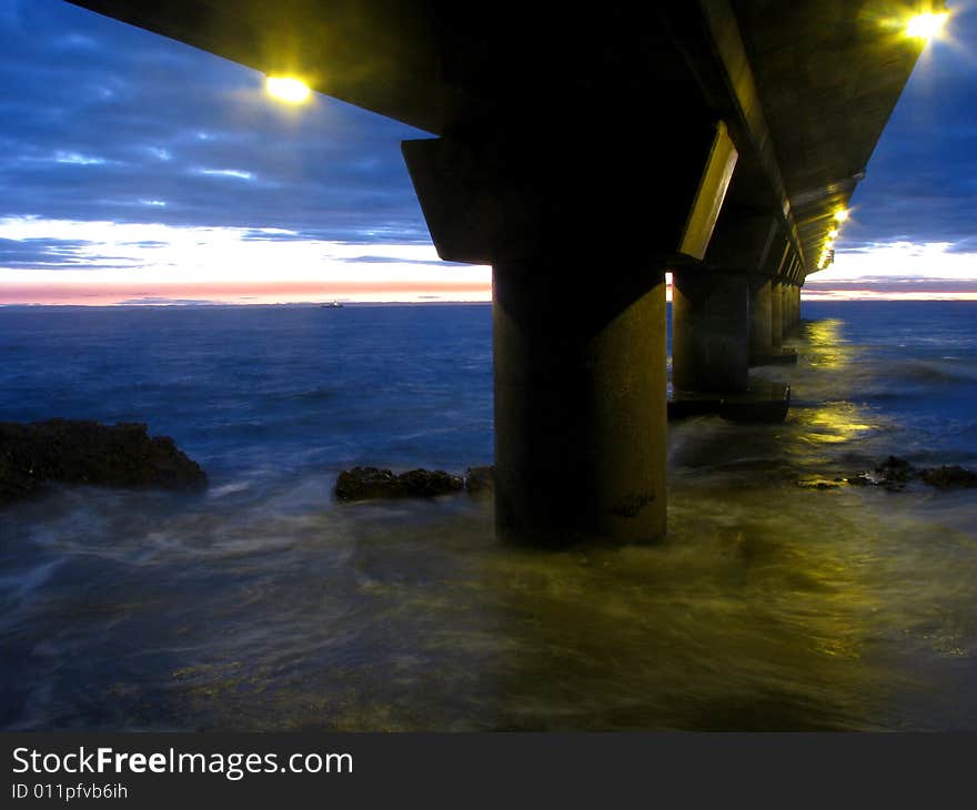 Pillar of pier at sunrise