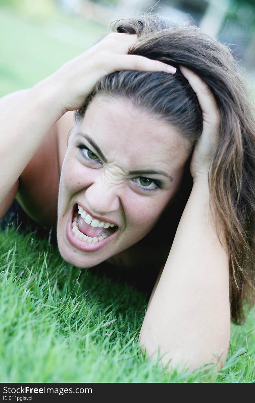 Portrait of a woman with an angry expression.